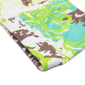 Close-up of tropical palm print on quick-dry men swimwear fabric with precise stitching