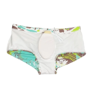 Detail of men's swim trunks with tropical palm print, drawstring waist and u-convex pouch