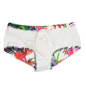 Detail view of tropical palm leaf print swim trunks with interior lining and drawstring