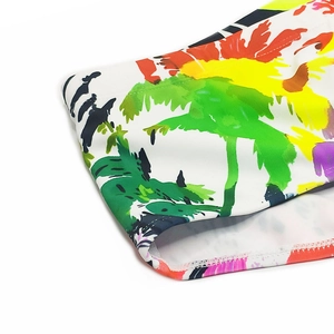 Detail of colorful palm tree oil painting print on high-elastic white swim trunks