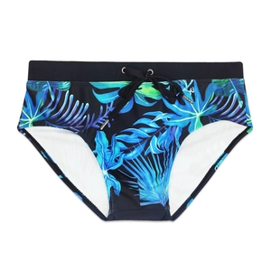 Men's black swim briefs with tropical blue and green leaf prints and adjustable drawstring
