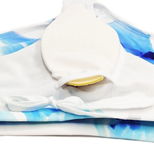 Macro shot of blue lily ink print swimwear showing inner mesh lining and removable padding