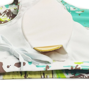 Detail view of men's swim shorts featuring white mesh lining and removable padded cup insert
