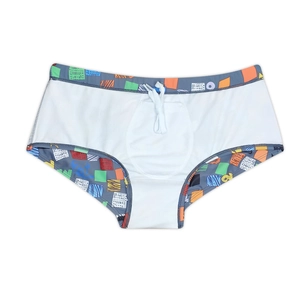Detail of men's colorful geometric pattern swim trunks with adjustable white drawstring