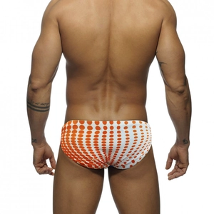 Back view of men's polka dot swim briefs showing modern orange prints and fit