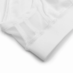 Detail of white mesh breathable fabric and professional flatlock stitching on men's swimwear