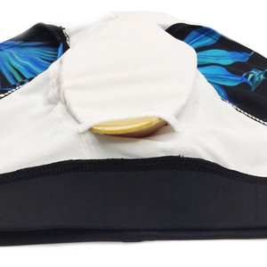 Macro detail of the swimsuit inner pocket showing the removable yellow padding insert