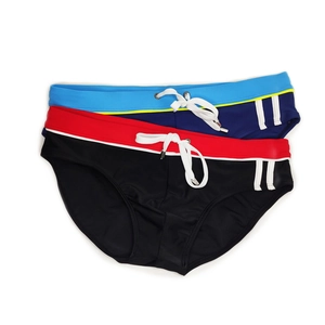 Flat lay of men's athletic swim briefs in black and navy with contrast side stripes