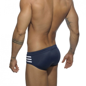Rear view of navy blue swim briefs with white side stripes and slim fit athletic design