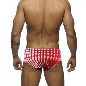 Rear view of men's swim briefs featuring red fabric with white polka dots for swimming