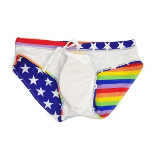 Detail view of men's swim briefs featuring rainbow stripes and star patterns with push-up pad