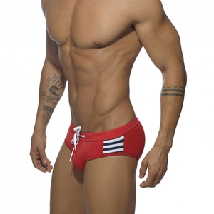 Men's low-waist red swim briefs with side stripes and adjustable white drawstring