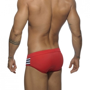 Rear view of men's red swim briefs with side stripes and athletic low-rise fit