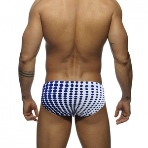 Rear view of men's polka dot swim briefs in white and navy blue with a snug fit