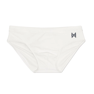 Detailed close-up of white men's swim briefs showing elastic fabric and logo print