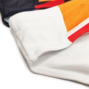 Detail of color-block swim briefs showing high-elastic fabric and flatlock stitching