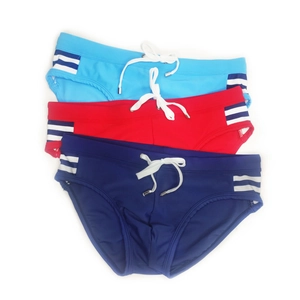 Flat lay of men's low-waisted swim trunks in blue, red, and navy with side stripes