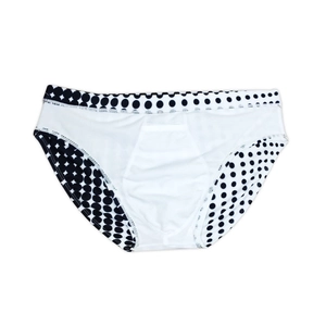 Flat lay close-up of men's briefs featuring classic black polka dots on breathable fabric
