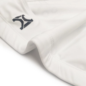 Detailed close-up of white swim briefs showing fine fabric texture and neat double-stitching