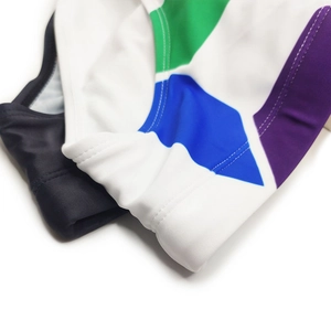 Detail shot of multi-color geometric men's swim briefs with reinforced stitching