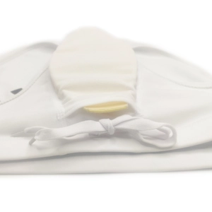 Close-up of white swimwear waistband featuring adjustable drawstring and interior padding pocket