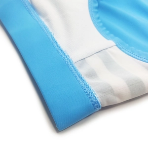 Macro detail of breathable sky blue and white mesh fabric with reinforced flat seams