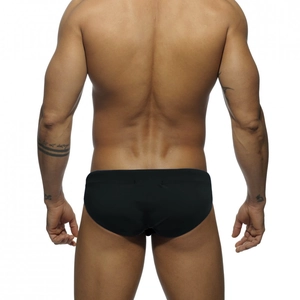 Rear view of black athletic men's swim briefs with premium stretch fit on model