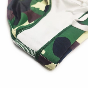 Detail of army green camouflage swim briefs with white drawstring and reinforced stitching