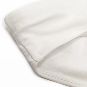 Close-up of high-elastic white fabric showing fine double-stitch sewing on the waistband
