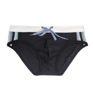 Detail of men's swim briefs showing elastic white waistband and blue drawstring contrast