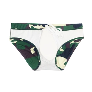 Detail view of camouflage swim trunks featuring a white drawstring and open crotch design