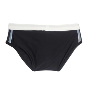 Detail of men's swim briefs showing black polyester fabric and white contrast waistband
