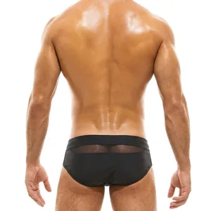 Men's sexy black low-rise swim trunks with wide waistband and mesh patchwork detail