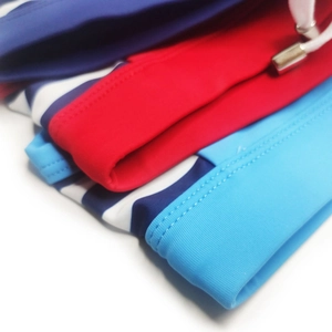 Detail of elastic waist with white drawstring and metal tips on men swim briefs