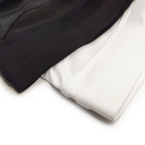 Detail of men's swim briefs showing breathable mesh splicing and elastic waistband