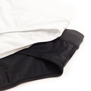 Macro detail of high-elasticity mesh swimwear fabric with reinforced stitching and texture