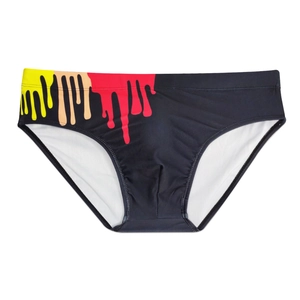 Close-up of men's black swim briefs featuring artistic colorful drip paint pattern detail