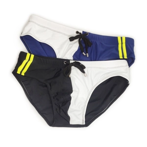 Detail of men's athletic swim briefs featuring contrast side panels and adjustable drawstrings