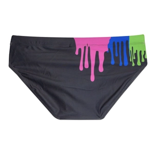 Detail of black men's swim briefs featuring vibrant pink and blue paint drip art print