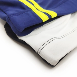 Close-up of athletic swim briefs showing elastic fabric and precise stitching detail