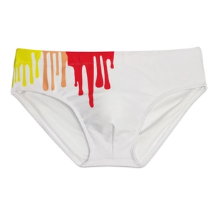 Detailed view of white men's swim briefs with vibrant yellow and red paint drip print