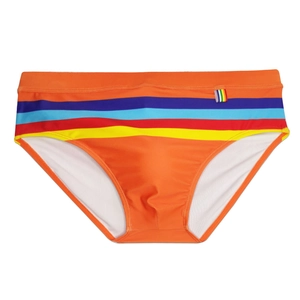Detailed close-up of orange men's swim briefs featuring colorful rainbow stripe accents