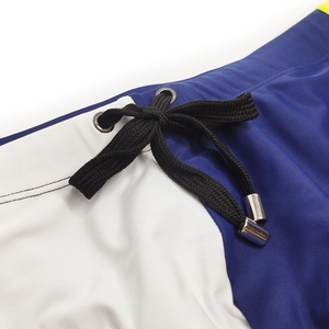 Detail of men's athletic swimwear waist with blue contrast and black braided drawstring