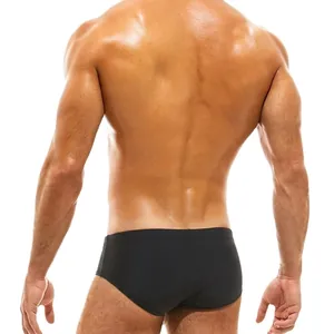 Men's sexy black low-rise swim briefs with translucent mesh back paneling details