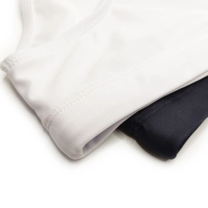 Detail view of the fine stitching and high-elastic fabric on men's swimwear