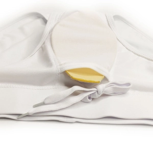 Detail view of white swim trunks featuring a removable yellow padding cup insert