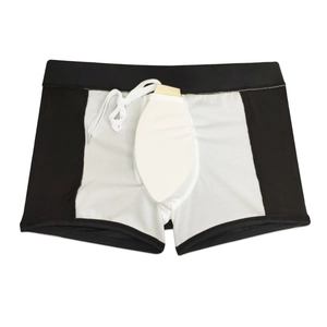 Detail view of men's swim trunks with sheer mesh panels and removable protective inner cup