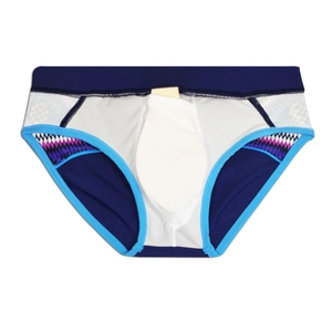 Detail view of ethnic patchwork swim briefs featuring a white U-convex pouch design