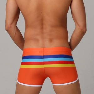 Men's bright orange swim trunks featuring colorful stripes and white contrast piping trim