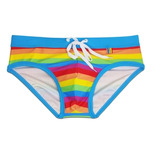 Detail of men's rainbow striped swim briefs with white drawstring and side tag